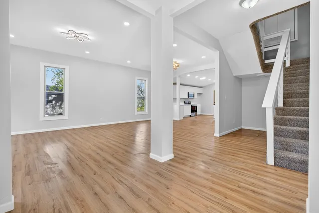 a kitchen with stainless steel appliances granite countertop a stove sink and cabinets