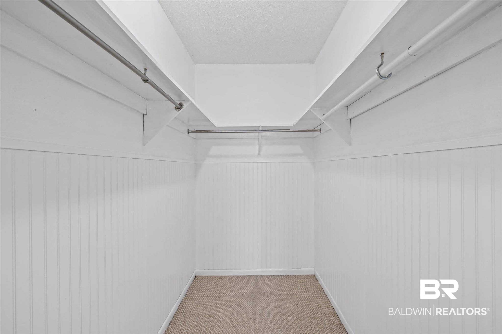 8090 Murray Hill Road Irvington, AL 36544 - Photo 21 of 40 Walk in closet featuring light carpet