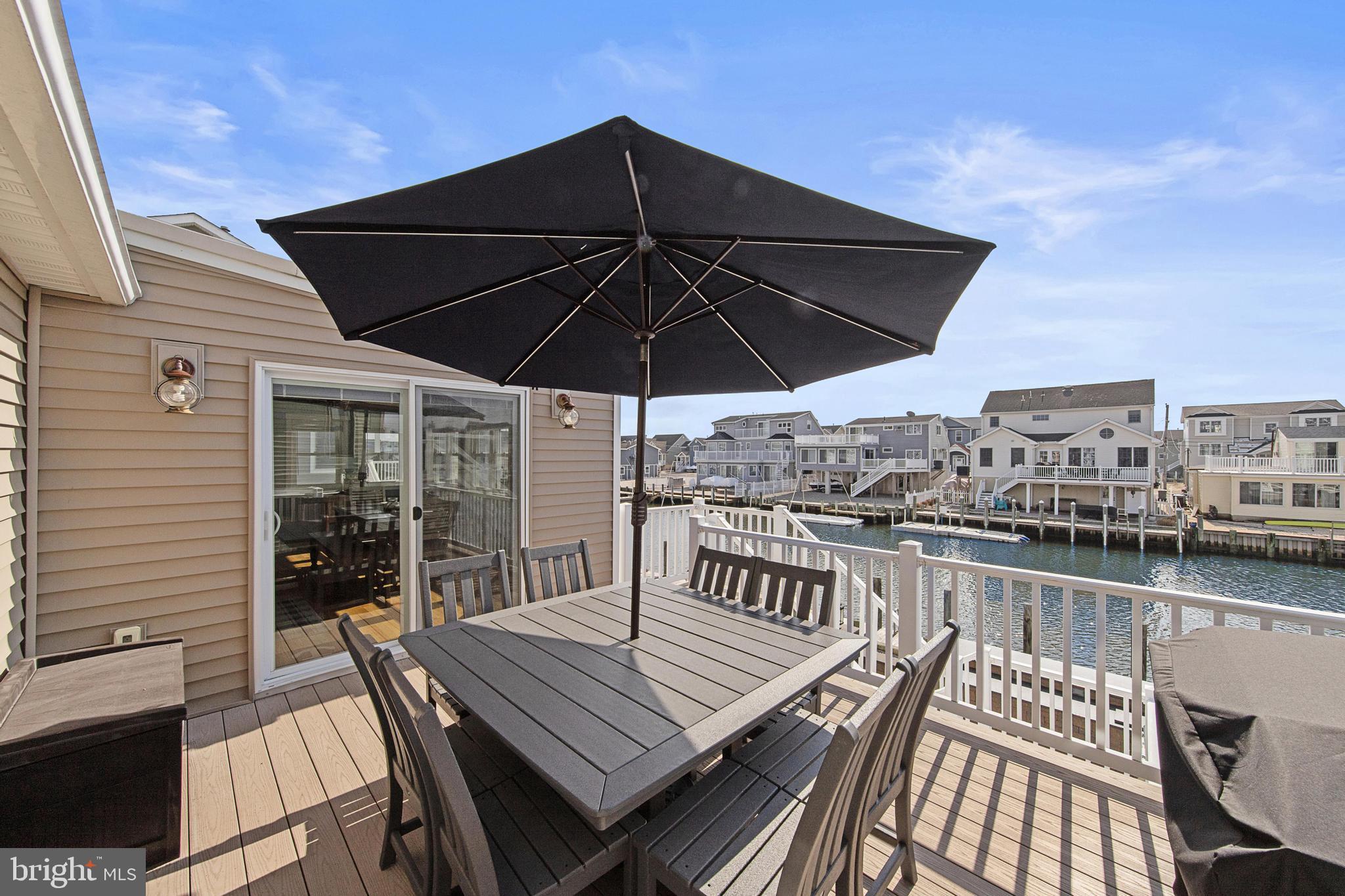 304 Morris Boulevard Manahawkin, NJ 08050 - Photo 16 of 55 a view of a roof deck with table and chairs