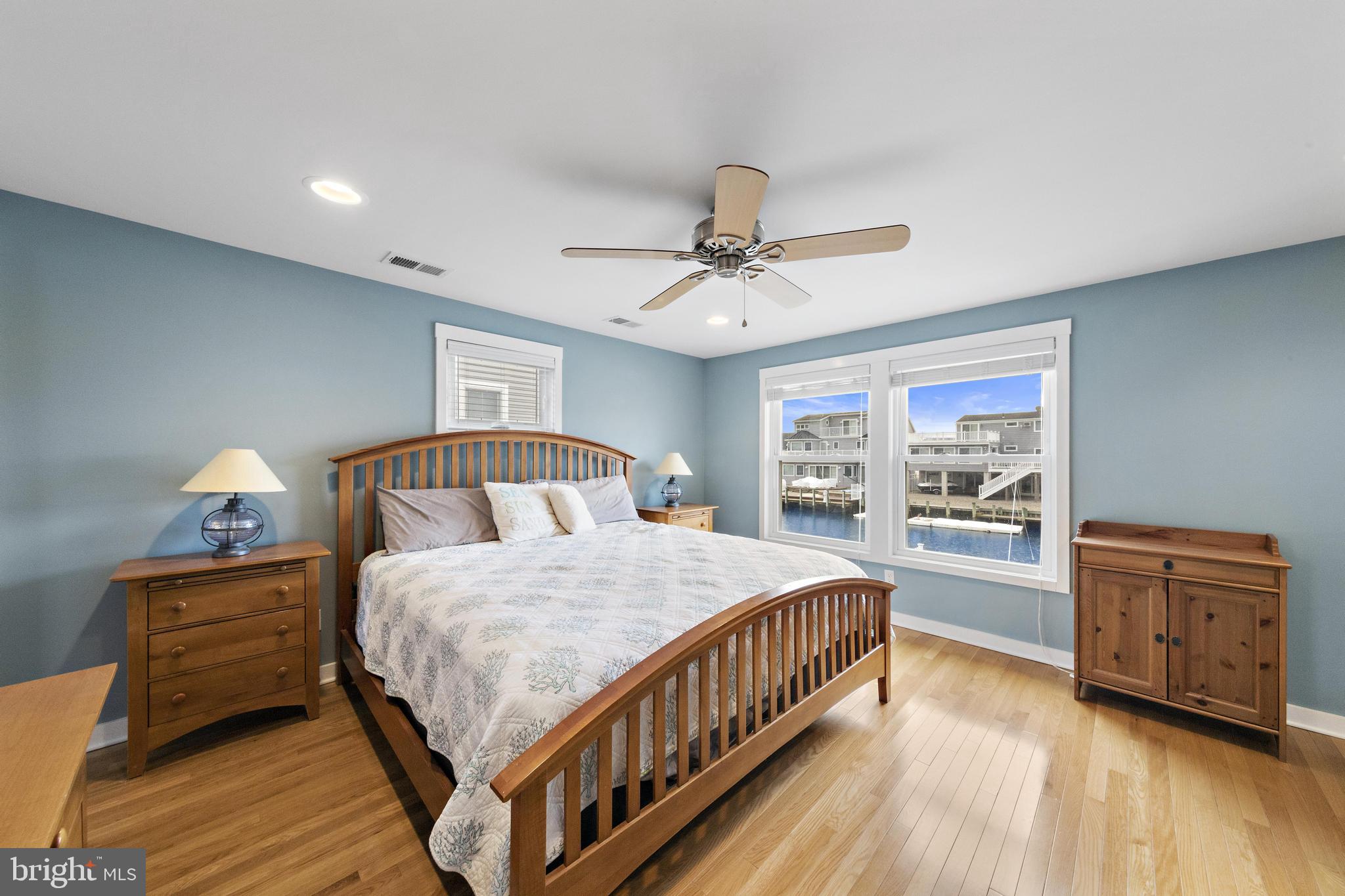 304 Morris Boulevard Manahawkin, NJ 08050 - Photo 19 of 55 a bedroom with a bed and a dresser in it