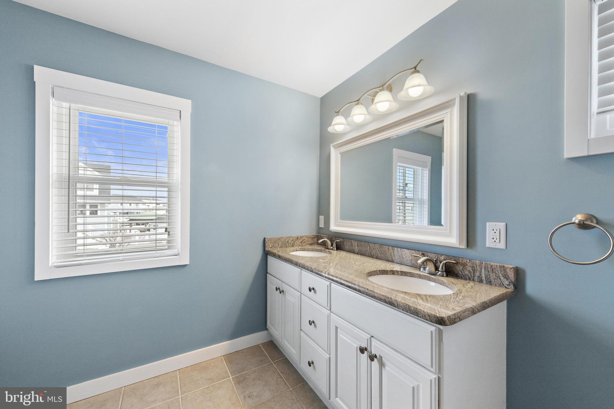 304 Morris Boulevard Manahawkin, NJ 08050 - Photo 21 of 55 a bathroom with 2 sink and a mirror
