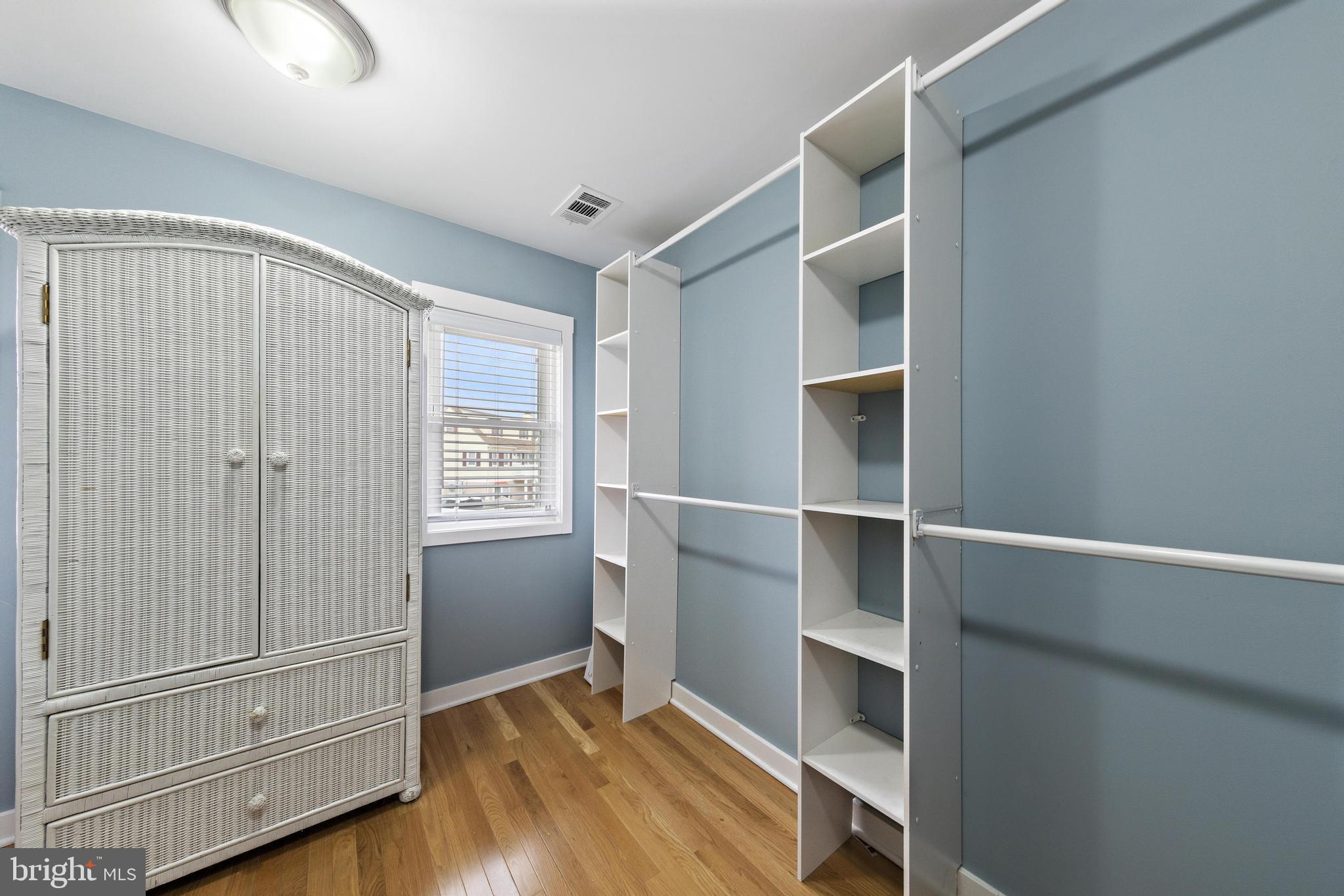 304 Morris Boulevard Manahawkin, NJ 08050 - Photo 22 of 55 a view of an empty room with wooden floor and a window