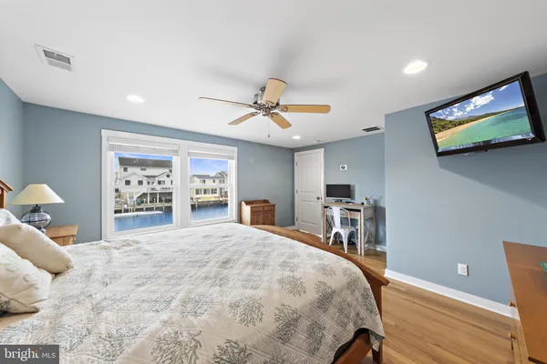 a bedroom with a bed and cabinets