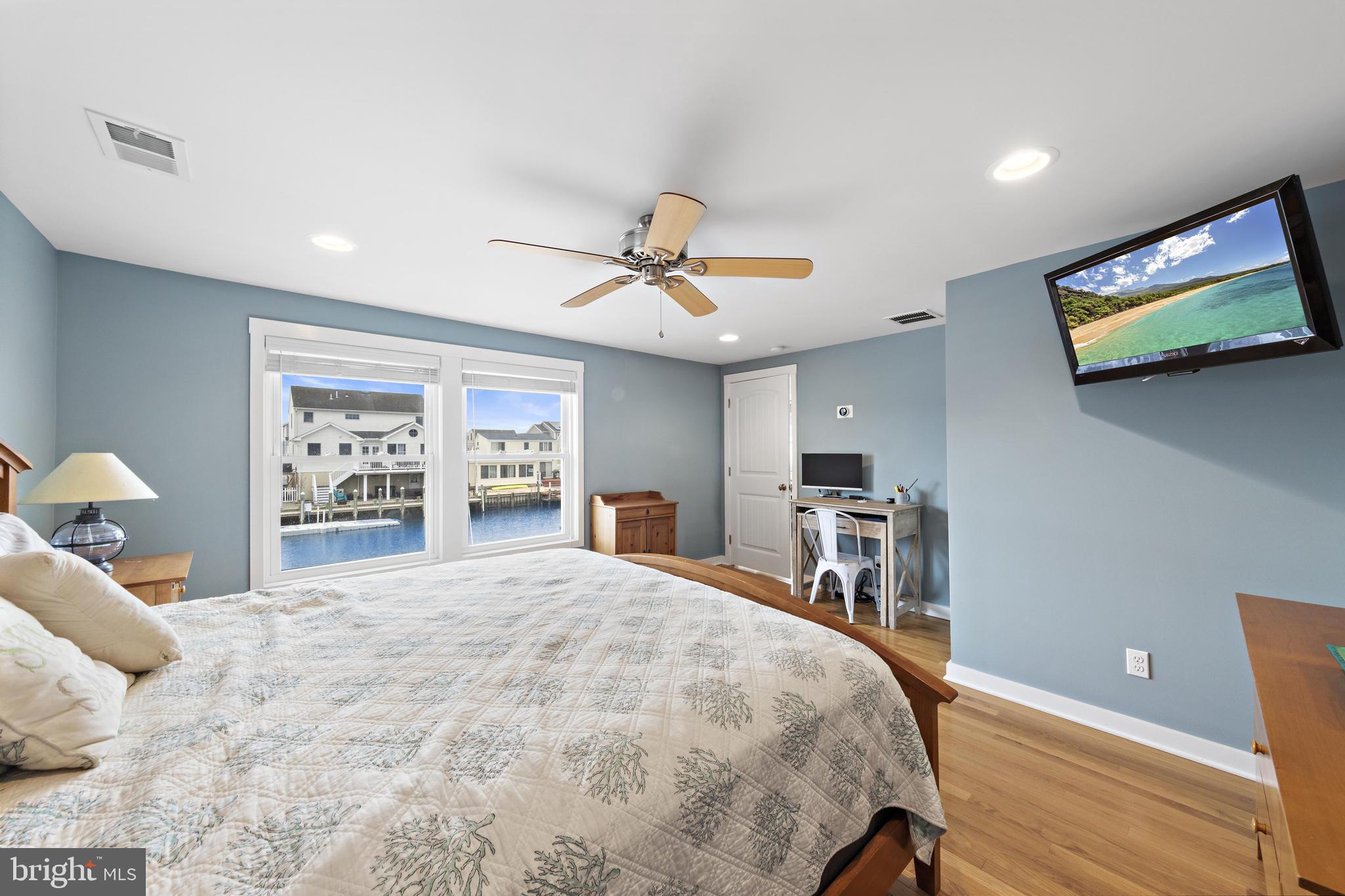304 Morris Boulevard Manahawkin, NJ 08050 - Photo 24 of 55 a bedroom with a bed and a flat screen tv