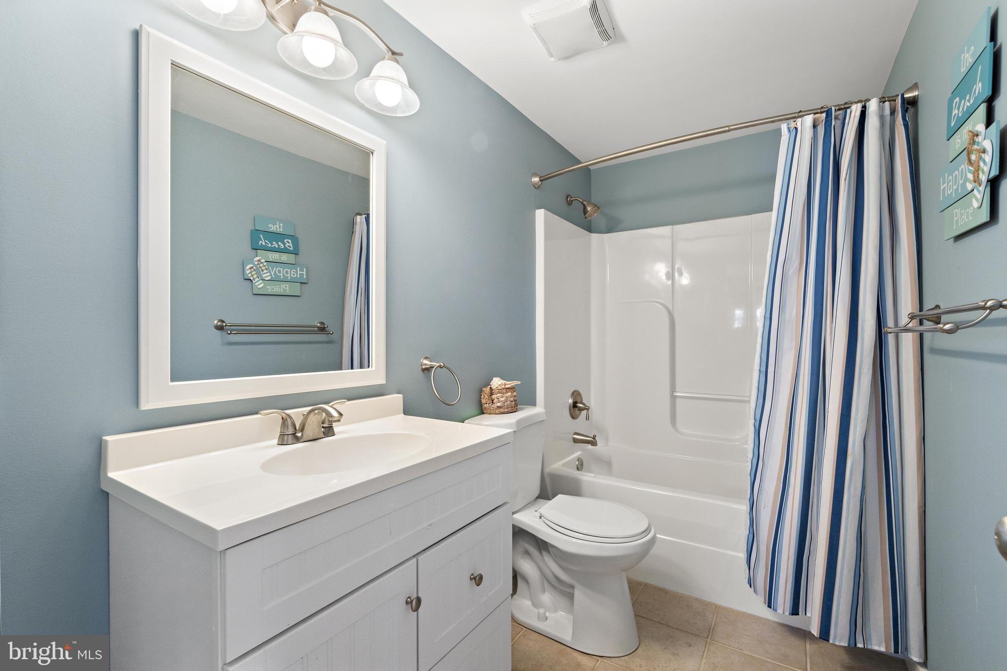 304 Morris Boulevard Manahawkin, NJ 08050 - Photo 28 of 55 a bathroom with a sink a toilet and shower
