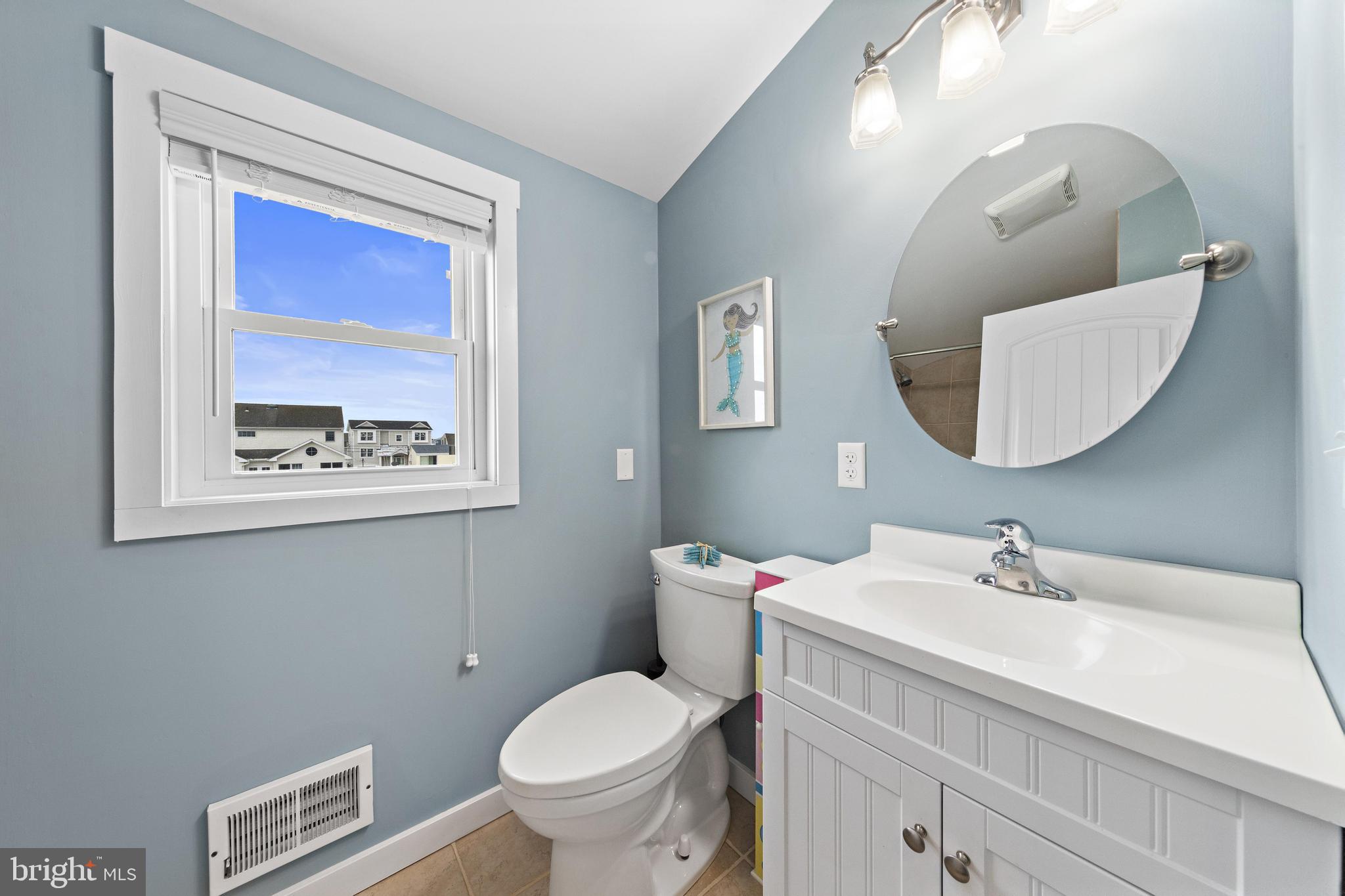 304 Morris Boulevard Manahawkin, NJ 08050 - Photo 35 of 55 a bathroom with a toilet sink and mirror