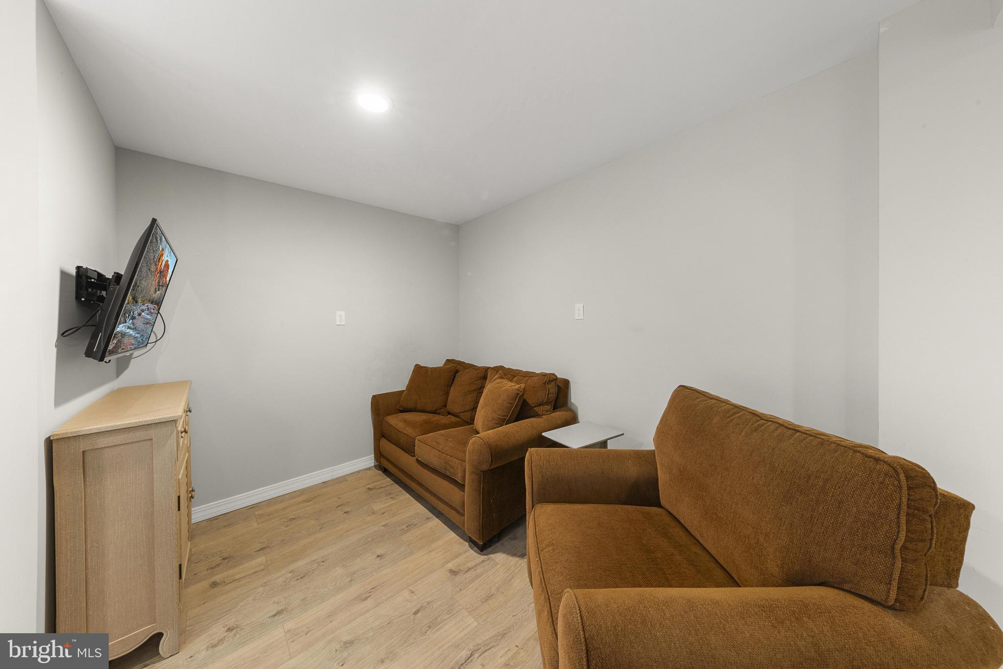 304 Morris Boulevard Manahawkin, NJ 08050 - Photo 42 of 55 a living room with furniture and a wooden floor