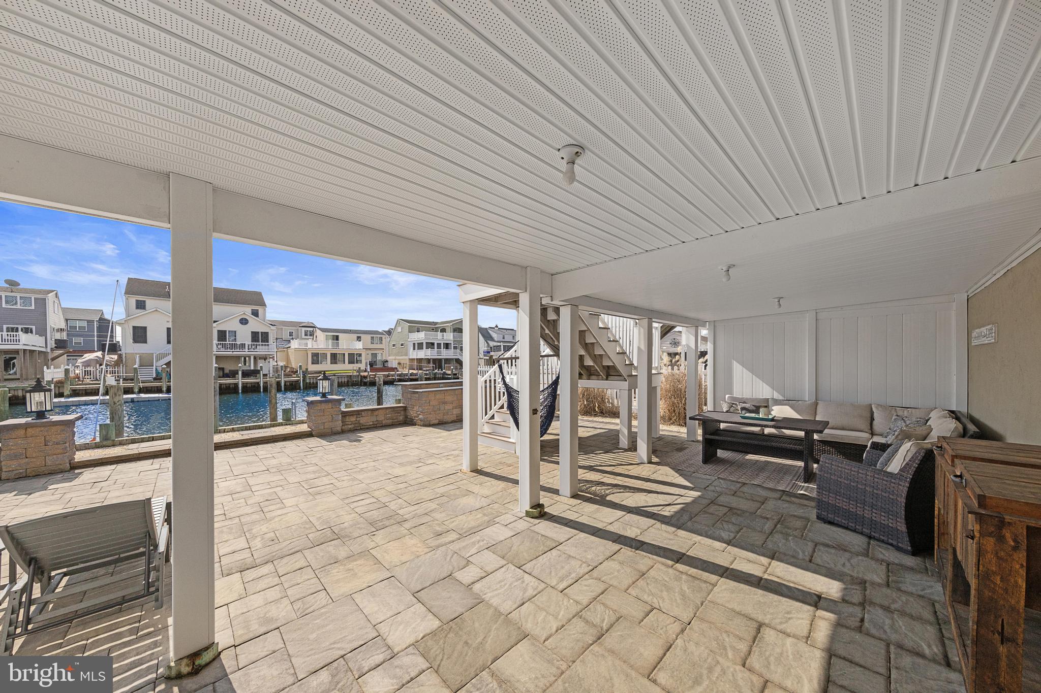 304 Morris Boulevard Manahawkin, NJ 08050 - Photo 45 of 55 a view of a patio with table and chairs