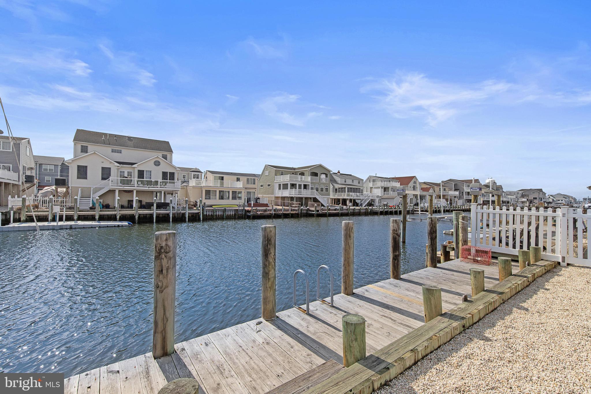 304 Morris Boulevard Manahawkin, NJ 08050 - Photo 52 of 55 a view of a lake with boats and trees in the background