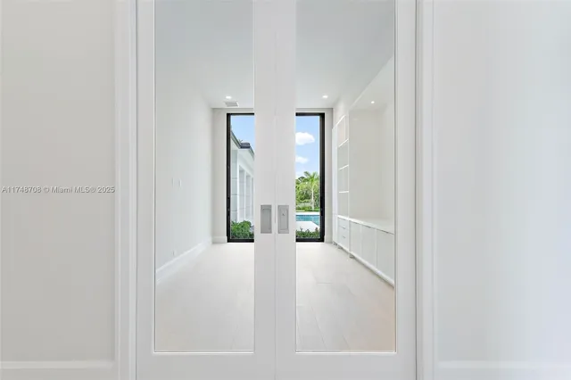 a view of empty room with floor to ceiling window