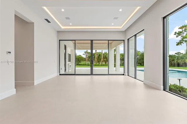 a living room with a large window and table