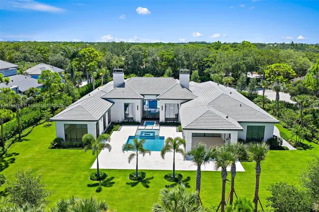 a view of swimming pool with outdoor seating and yard in back