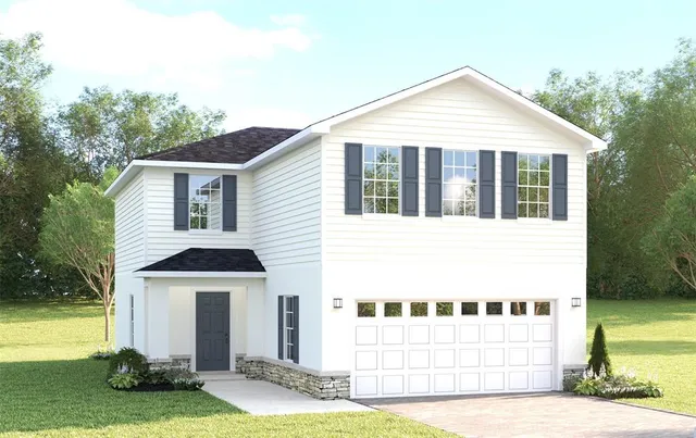 a view of a white house with a yard and potted plants