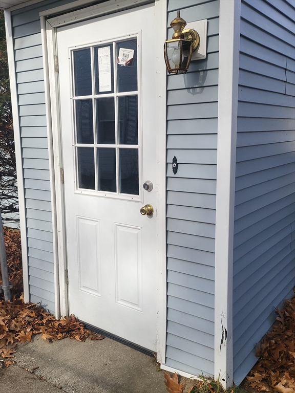 665 Parker Street Springfield, MA 01129 - Photo 18 of 25 a view of front door and potted plants