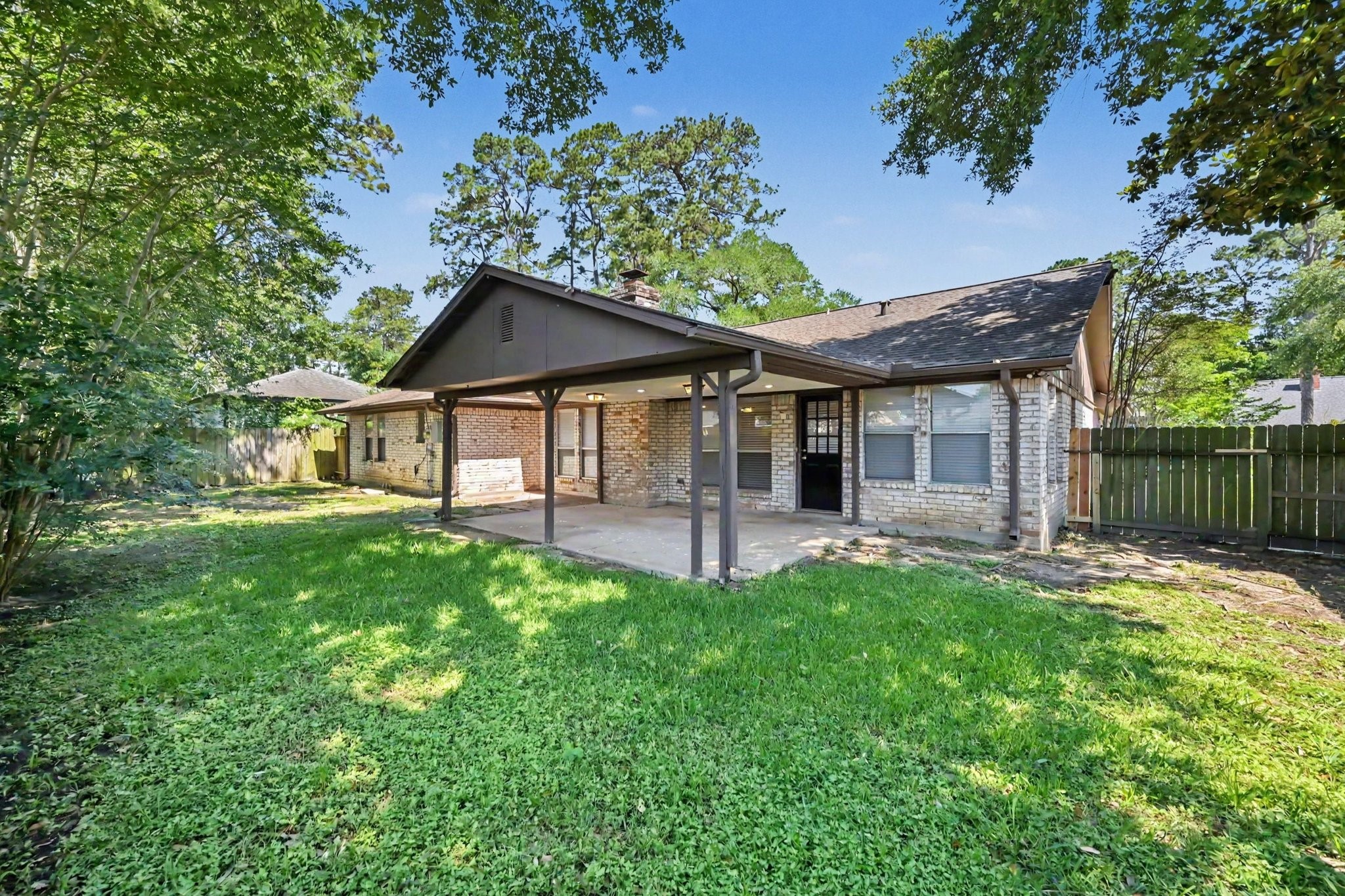 17419 Cassina Drive Spring, TX 77388 - Photo 35 of 35 a front view of a house with a yard and green space