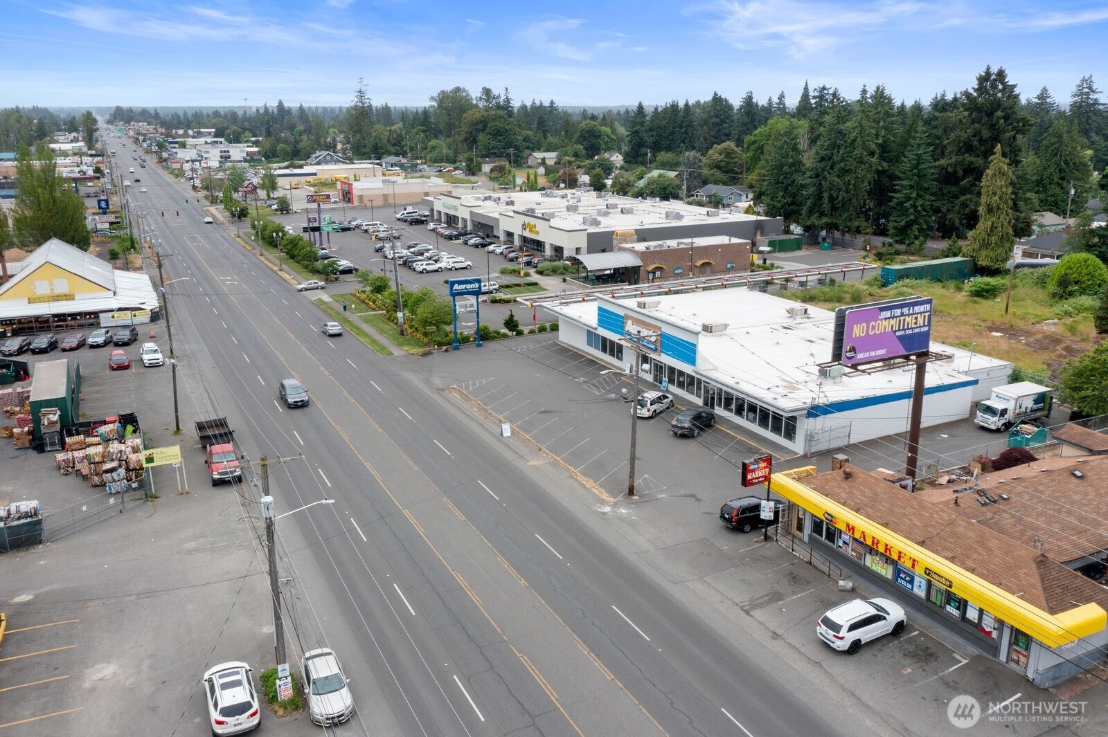 9618 Pacific Avenue Tacoma, WA 98444 - Photo 6 of 14 an aerial view of a swimming pool and mountain view in back