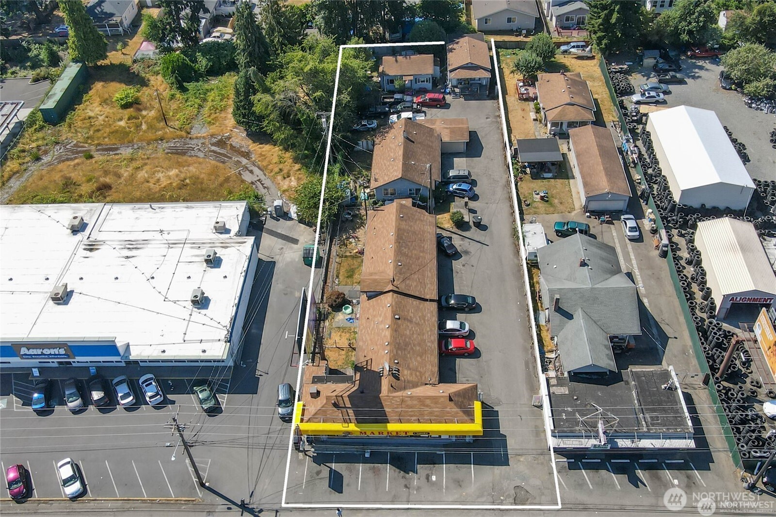 9618 Pacific Avenue Tacoma, WA 98444 - Photo 10 of 14 an aerial view of residential houses with outdoor space