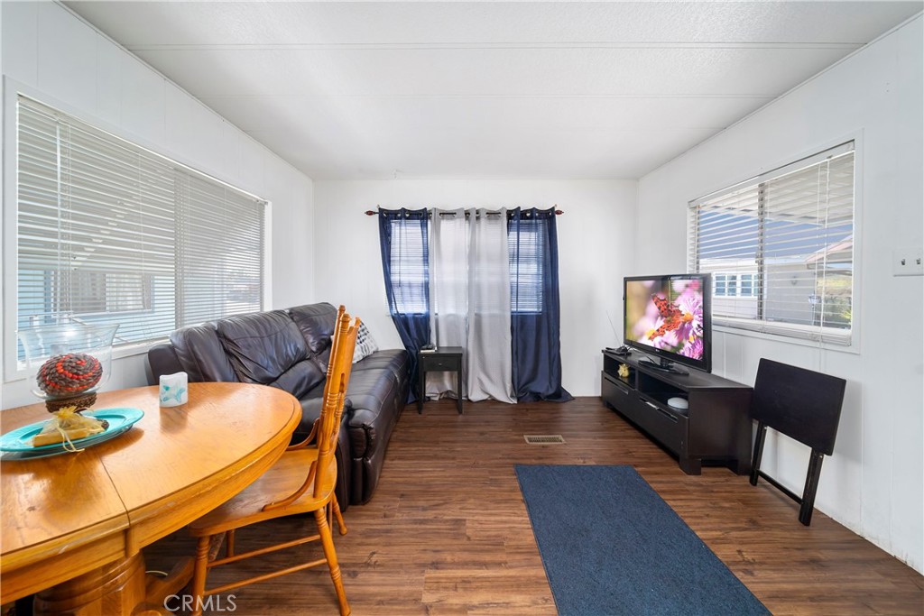 4101 Paramount Boulevard, Unit 27 Pico Rivera, CA 90660 - Photo 7 of 22 a living room with furniture and a flat screen tv