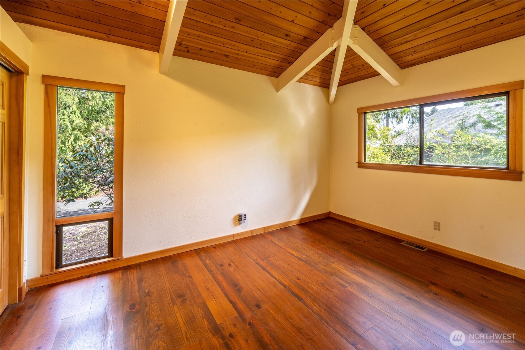 182 Sunset Place Sequim, WA 98382 - Photo 15 of 18 an empty room with wooden floor and windows