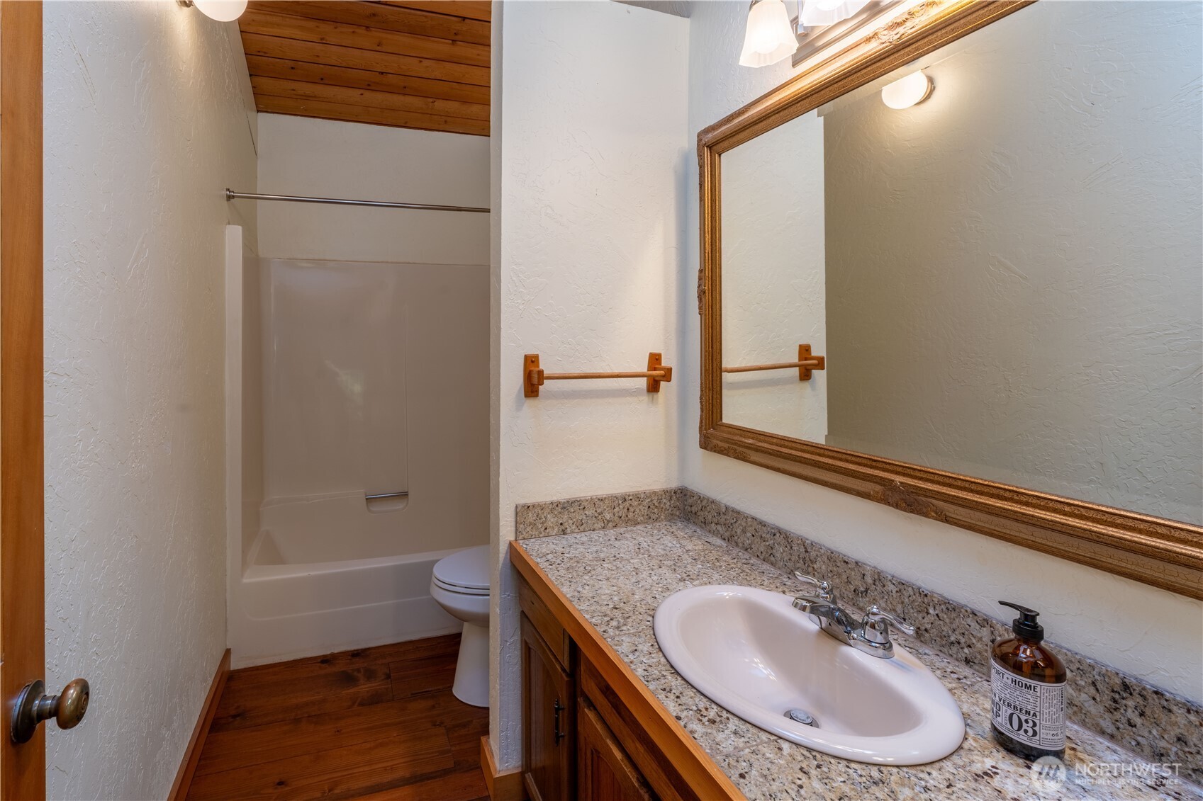 182 Sunset Place Sequim, WA 98382 - Photo 16 of 18 a bathroom with a granite countertop sink and a mirror