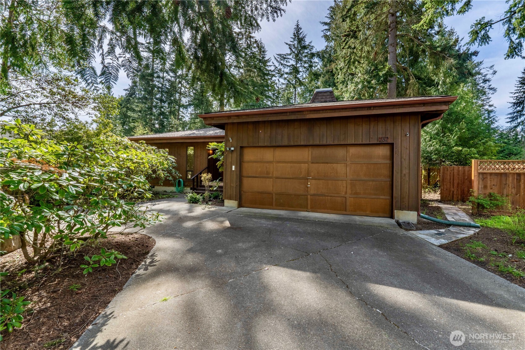 182 Sunset Place Sequim, WA 98382 - Photo 2 of 18 a view of a car garage