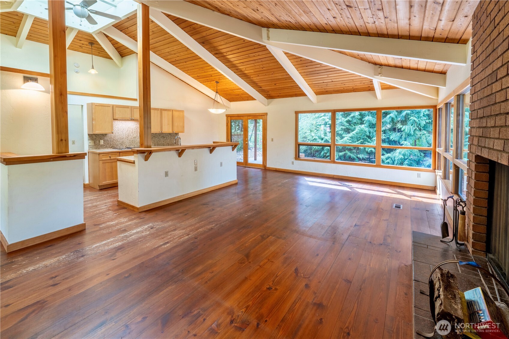 182 Sunset Place Sequim, WA 98382 - Photo 8 of 18 a view of empty room with wooden floor and fan