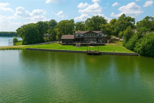 a view of a lake with a yard