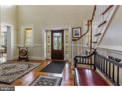 a view of an entryway with wooden floor