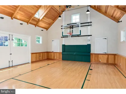 a view of an empty room with a fireplace and a flat screen tv