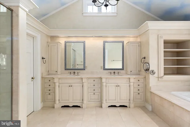 a bathroom with a granite countertop sink and a large mirror