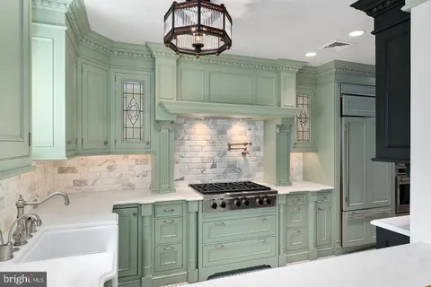 a kitchen with a stove and cabinets