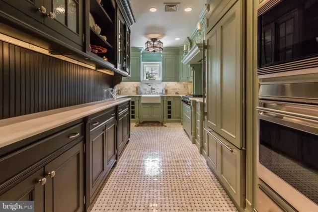 a bathroom with a sink a mirror and a shower