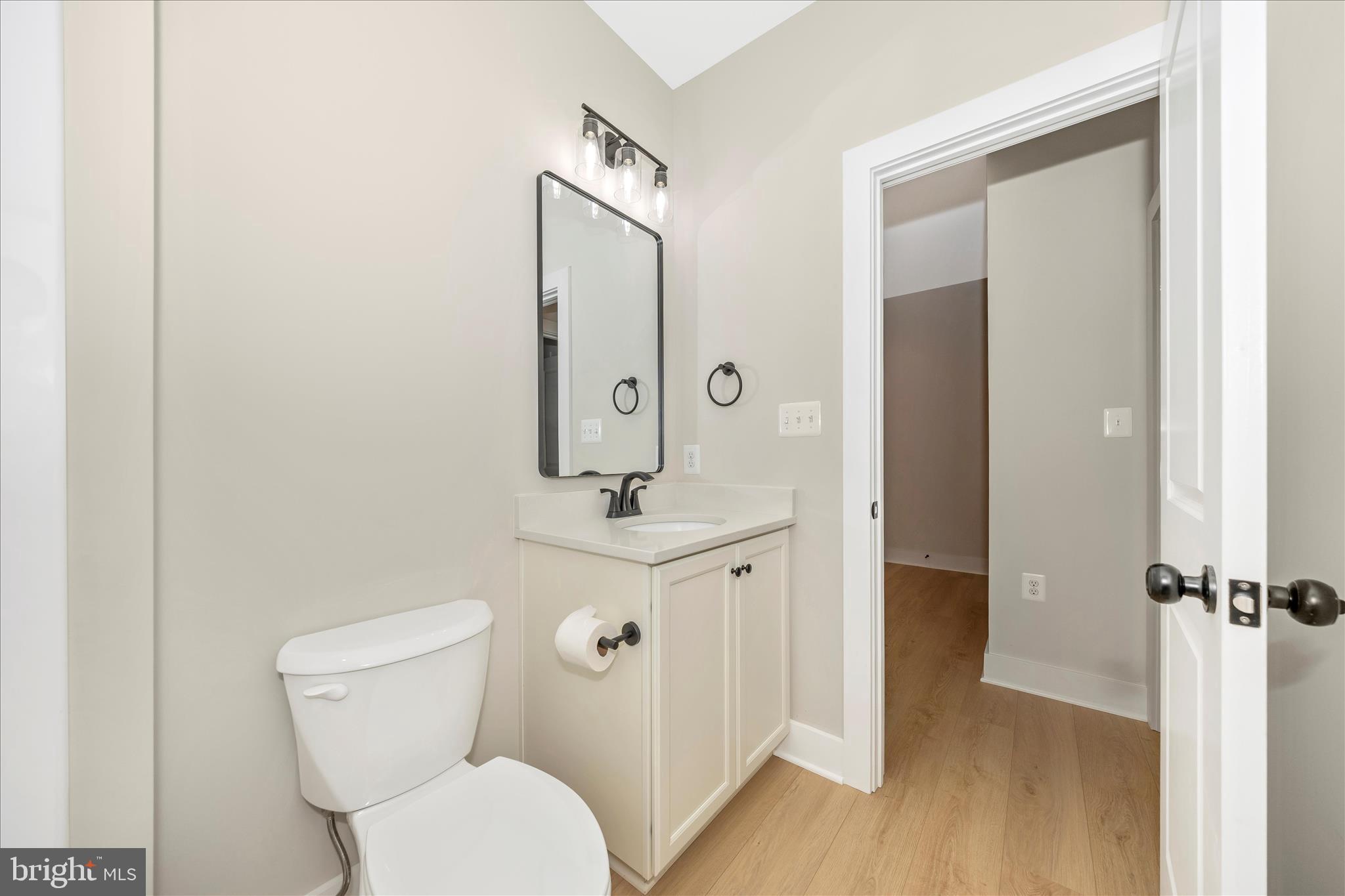 7816 Fairplay Road Fairplay, MD 21733 - Photo 8 of 34 a bathroom with a toilet a sink and mirror