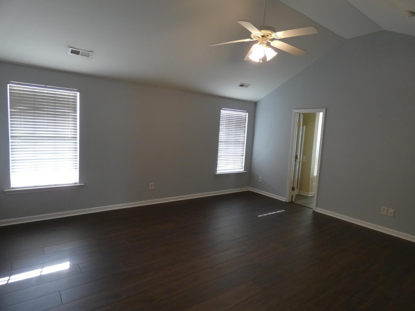 1624 Brown Owl Drive Raleigh, NC 27610 - Photo 16 of 22 a view of an empty room with wooden floor and a window