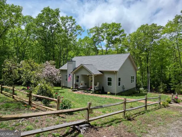 a house with trees in the background
