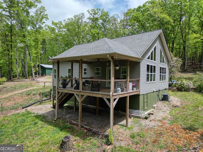 478 Flat Top Road, Unit 6 Young Harris, GA 30582 - Photo 2 of 70 a house with trees in the background