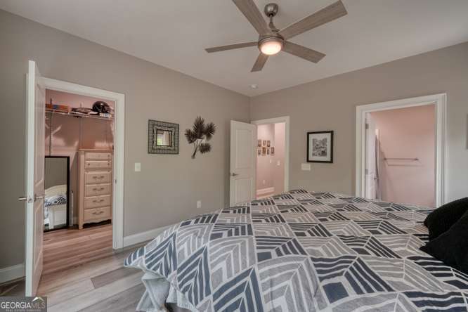 478 Flat Top Road, Unit 6 Young Harris, GA 30582 - Photo 26 of 70 a bedroom with a large bed and a chandelier