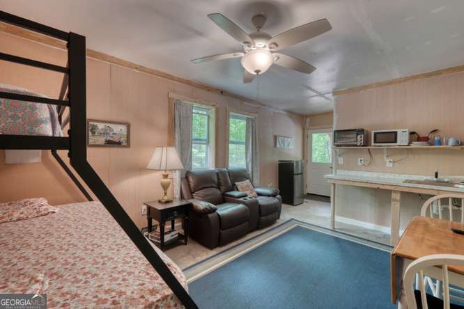 478 Flat Top Road, Unit 6 Young Harris, GA 30582 - Photo 50 of 70 a living room with furniture and a chandelier