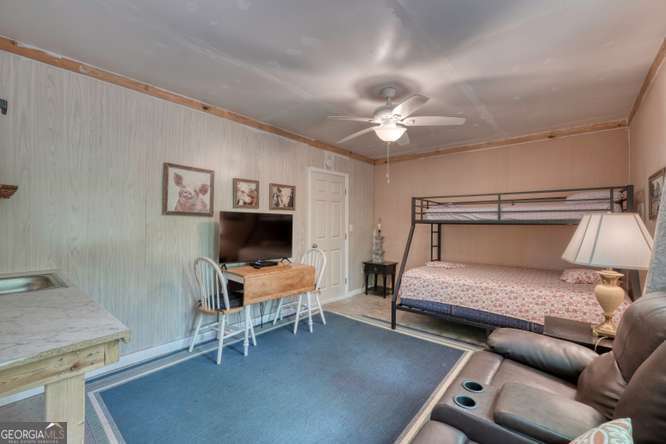 478 Flat Top Road, Unit 6 Young Harris, GA 30582 - Photo 52 of 70 a bedroom with furniture and a chandelier