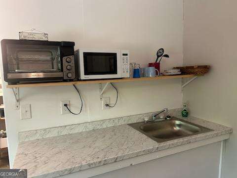 478 Flat Top Road, Unit 6 Young Harris, GA 30582 - Photo 67 of 70 a bathroom with a sink and a mirror