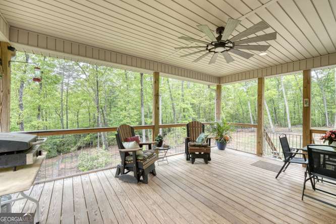 478 Flat Top Road, Unit 6 Young Harris, GA 30582 - Photo 7 of 70 a living room with furniture and floor to ceiling windows
