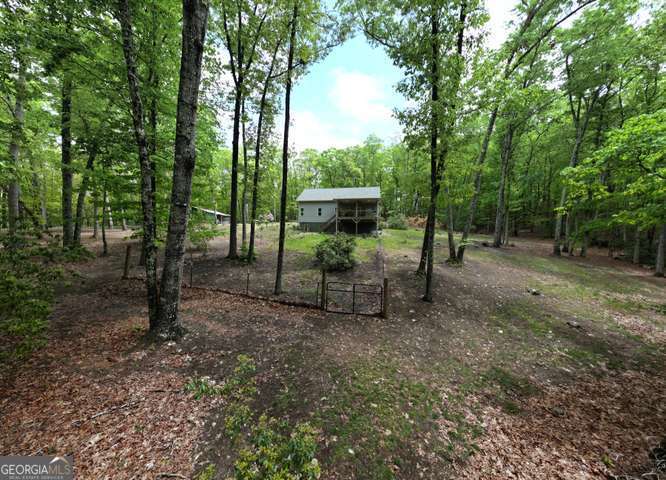 478 Flat Top Road, Unit 6 Young Harris, GA 30582 - Photo 9 of 70 a view of a two chairs in a backyard