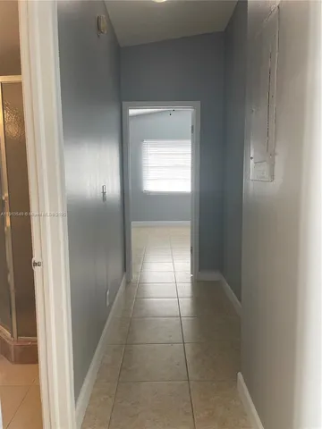 a view of hallway with a window