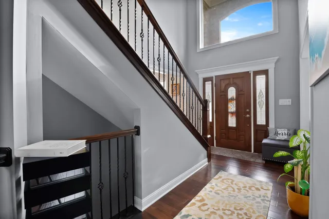a view of entryway with wooden floor and a rug
