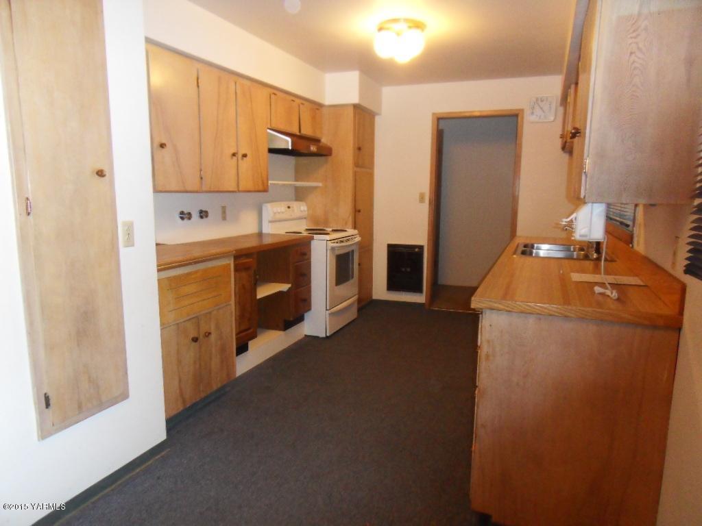 14661 Rutherford Road Yakima, WA 98903 - Photo 14 of 30 a kitchen with sink a stove and refrigerator
