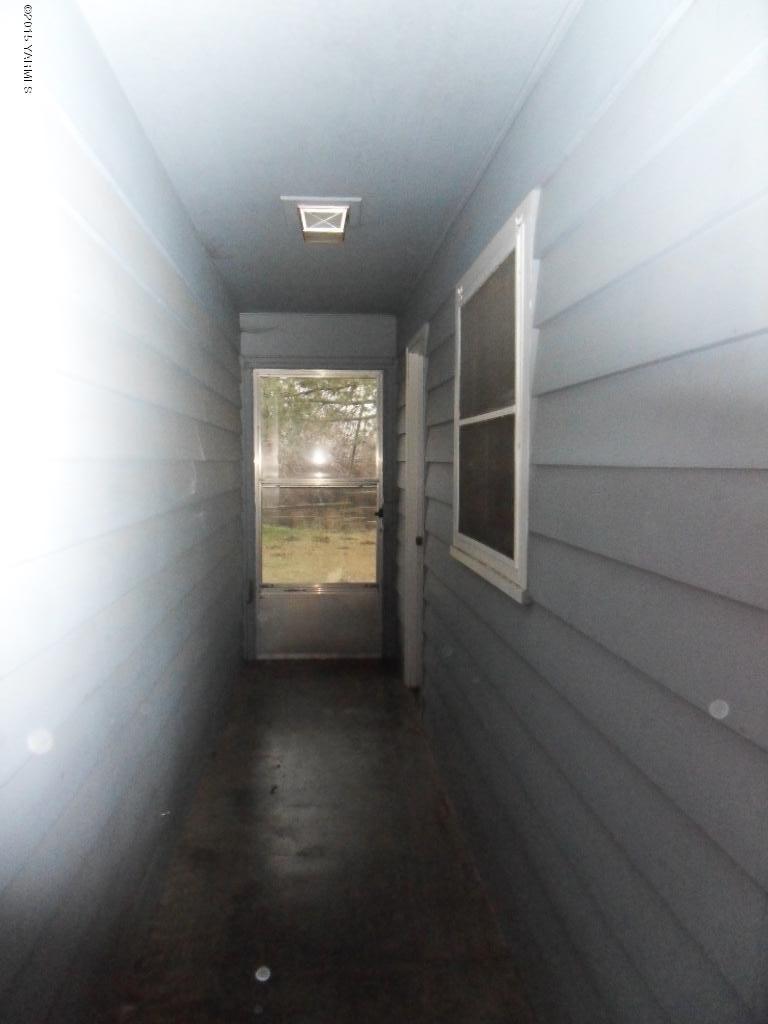 14661 Rutherford Road Yakima, WA 98903 - Photo 25 of 30 a view of empty room with wooden floor and fan