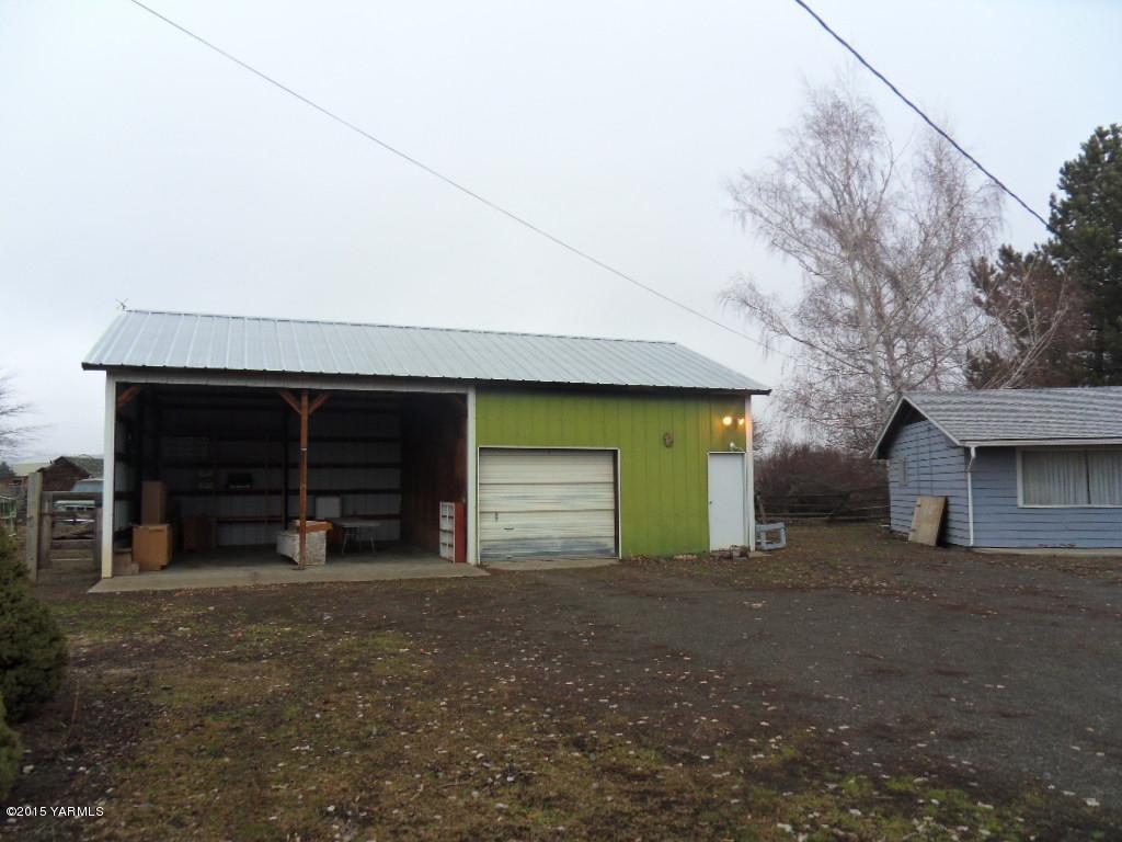14661 Rutherford Road Yakima, WA 98903 - Photo 10 of 30 a view of a house with a yard and garage