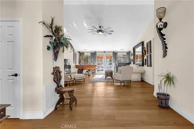 a living room with furniture and a potted plant