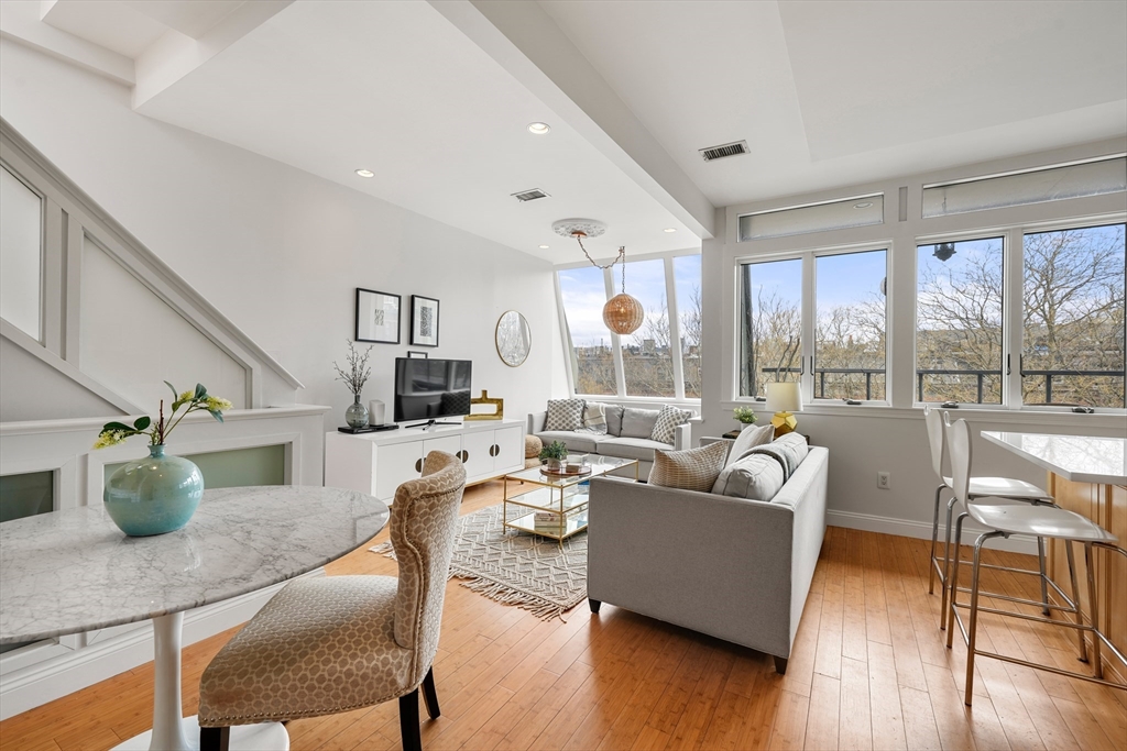 21 Worcester Square, Unit 5 Boston, MA 02118 - Photo 12 of 33 a living room with fireplace furniture and a wooden floor