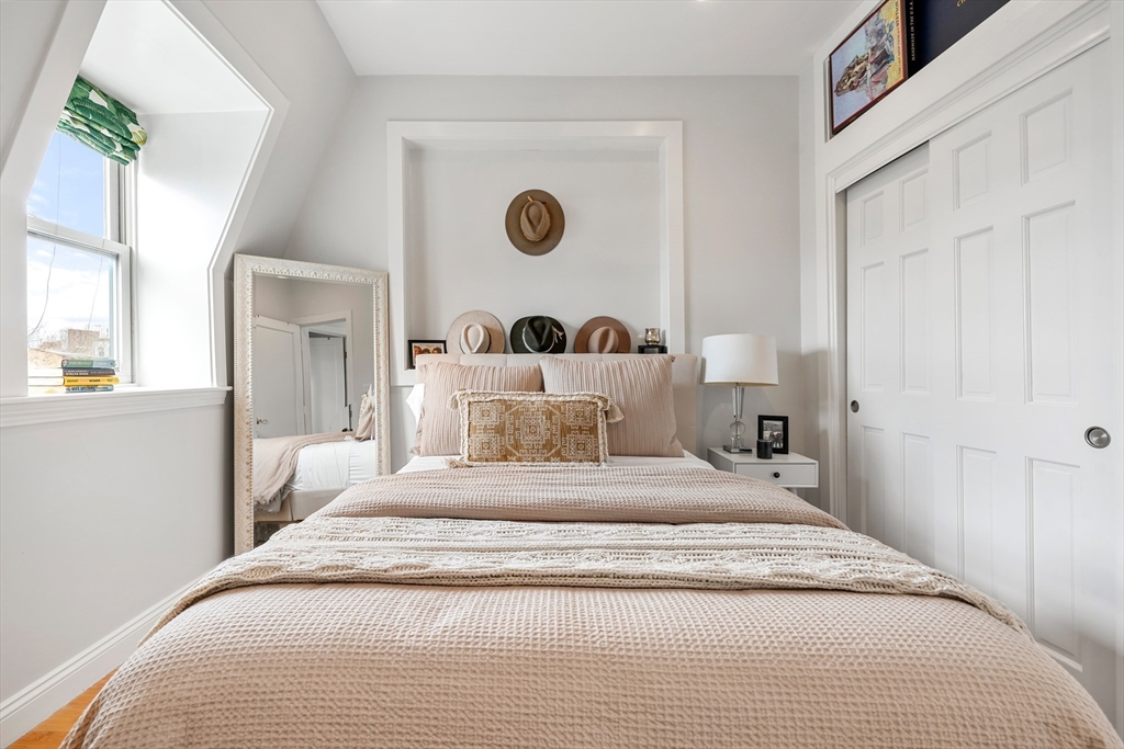 21 Worcester Square, Unit 5 Boston, MA 02118 - Photo 17 of 33 a large white bed in a white room
